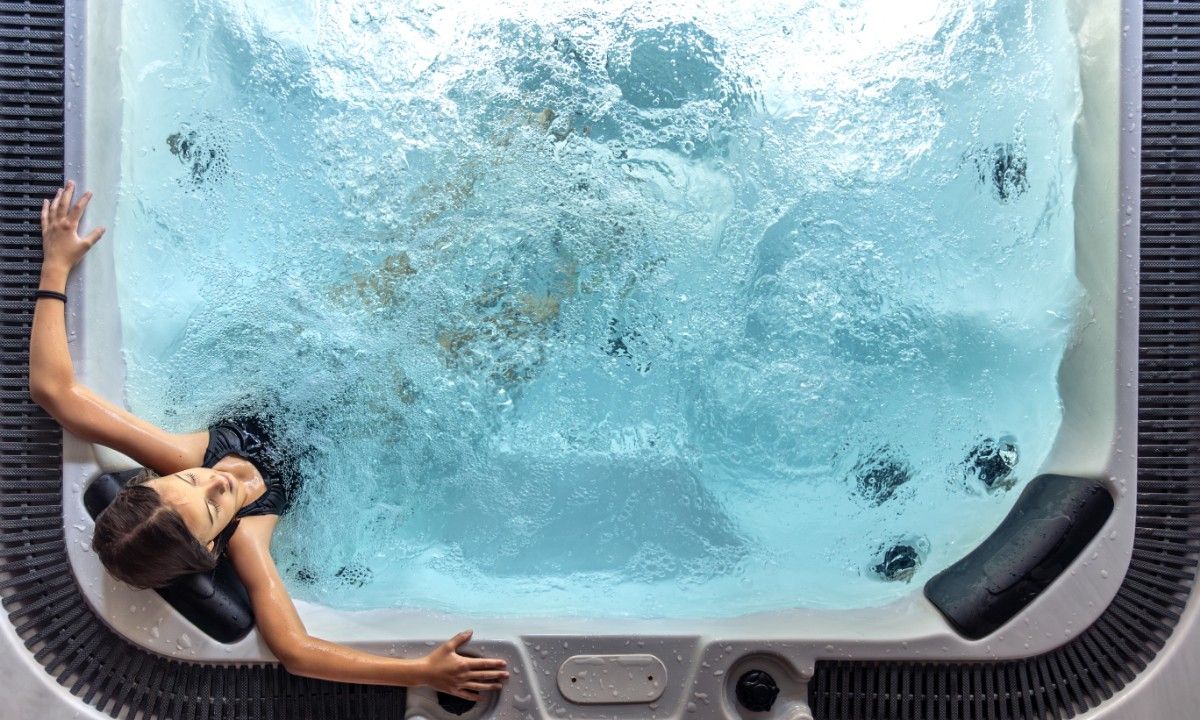 girl-spa-hot-tub-seen-from-with-bubbling-water-overhead-view (1)